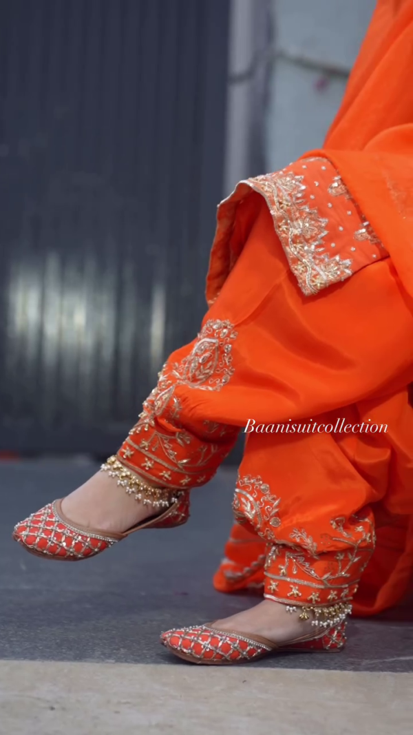 Exotic Orange Color Thread Work Top – A Bold and Elegant Addition to Your Wardrobe