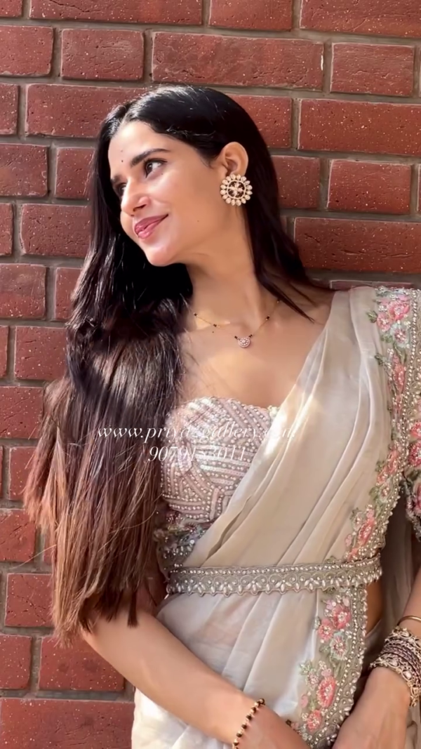 Elegant Beige Embroidered Saree